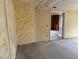 Open living room featuring an open doorway and unfinished walls, ready for personalization at 2451 E Falcon St, Pahrump, NV 89048