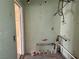 Utility room featuring exposed plumbing, ready for customization and updates at 2451 E Falcon St, Pahrump, NV 89048