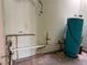 Utility room with water tank and plumbing, ready for renovation and upgrades at 2451 E Falcon St, Pahrump, NV 89048