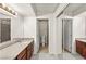 Bathroom view featuring cabinets, countertop, sink, toilet and a shower at 2606 S Durango Dr # 276, Las Vegas, NV 89117