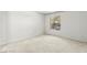 Bright, light-filled bedroom with neutral carpet and large window at 2606 S Durango Dr # 276, Las Vegas, NV 89117