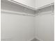A bright white closet features shelving and rack for optimized storage at 2606 S Durango Dr # 276, Las Vegas, NV 89117