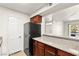 Efficient kitchen featuring stainless steel appliances, wood cabinets, and granite counters at 2606 S Durango Dr # 276, Las Vegas, NV 89117