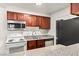 Well-equipped kitchen featuring wood cabinets and modern appliances at 2606 S Durango Dr # 276, Las Vegas, NV 89117