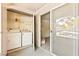 Laundry area features a washer and dryer, plus shelves for storage and a sliding glass door at 2606 S Durango Dr # 276, Las Vegas, NV 89117