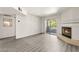 Spacious living area with laminate flooring, a modern fireplace, and lots of natural light at 2606 S Durango Dr # 276, Las Vegas, NV 89117