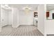 Open-concept living and dining area with new gray flooring and a ceiling fan at 2606 S Durango Dr # 276, Las Vegas, NV 89117