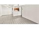 Spacious living room with lots of light featuring updated gray wood-look flooring at 2606 S Durango Dr # 276, Las Vegas, NV 89117
