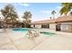 Beautiful community pool and hot tub with nearby lounge chairs and tables at 2606 S Durango Dr # 276, Las Vegas, NV 89117