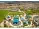 Aerial view of a park featuring a playground and splash pad for Gathering fun and outdoor activities at 2787 Donatello Manor Pl, Henderson, NV 89044