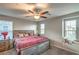 Comfortable bedroom with carpet, a ceiling fan, and a window seat perfect for relaxing and reading at 2787 Donatello Manor Pl, Henderson, NV 89044