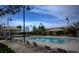 Serene community pool area with comfortable seating, perfect for relaxation and enjoying the outdoors at 2787 Donatello Manor Pl, Henderson, NV 89044
