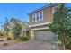 Charming two-story home with desert landscaping and a two-car garage on a brick driveway at 2787 Donatello Manor Pl, Henderson, NV 89044