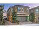 Attractive two-story home boasting a neutral stucco exterior, neat landscaping, and a two-car garage at 2787 Donatello Manor Pl, Henderson, NV 89044