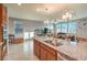 Granite countertops and island create a fantastic, spacious kitchen area for entertaining at 2787 Donatello Manor Pl, Henderson, NV 89044