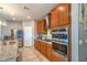Modern kitchen with stainless steel appliances, and beautiful wood cabinets at 2787 Donatello Manor Pl, Henderson, NV 89044
