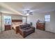 Serene primary bedroom features a ceiling fan, natural light, and plush carpet at 2787 Donatello Manor Pl, Henderson, NV 89044
