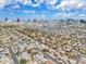 Wide aerial shot showcasing the neighborhood with a glimpse of the city's skyline, emphasizing its prime location at 2851 S Valley View Blvd # 1120, Las Vegas, NV 89102
