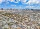 Expansive aerial view of a residential area with the Las Vegas skyline in the distance under a bright, partly cloudy sky at 2851 S Valley View Blvd # 1120, Las Vegas, NV 89102