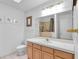 Bathroom featuring a vanity, toilet, and framed mirror at 2851 S Valley View Blvd # 1120, Las Vegas, NV 89102