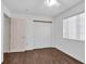 Empty bedroom featuring new floor and double closet doors at 2851 S Valley View Blvd # 1120, Las Vegas, NV 89102