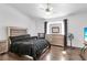 Well lit bedroom features a neutral color scheme, wooden floors, and ceiling fan at 2851 S Valley View Blvd # 1120, Las Vegas, NV 89102