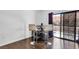 Dining area featuring stylish bar stools, sliding glass door and dark wood floors at 2851 S Valley View Blvd # 1120, Las Vegas, NV 89102
