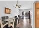 Bright dining room boasts a modern glass table, stylish chairs, and sleek hardwood flooring at 2851 S Valley View Blvd # 1120, Las Vegas, NV 89102