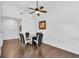 Bright dining area features a modern glass table, unique ceiling fan, and neutral walls at 2851 S Valley View Blvd # 1120, Las Vegas, NV 89102