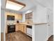 Cozy kitchen with light wooden cabinetry, laminate countertops and wood-look floors at 2851 S Valley View Blvd # 1120, Las Vegas, NV 89102