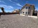Expansive backyard featuring desert landscaping, privacy walls, and a small bench seating area at 3238 Canyon Terrace Dr, Laughlin, NV 89029
