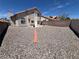 Expansive backyard featuring desert landscaping, privacy walls, and a small bench seating area at 3238 Canyon Terrace Dr, Laughlin, NV 89029