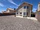 Expansive backyard featuring desert landscaping, privacy walls, and a small bench seating area at 3238 Canyon Terrace Dr, Laughlin, NV 89029