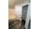 Bathroom featuring a shower-tub combo and a separate closet for storing linens and other items at 3238 Canyon Terrace Dr, Laughlin, NV 89029