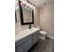 Cozy bathroom featuring a modern vanity with gray cabinetry and a sleek, dark faucet at 3238 Canyon Terrace Dr, Laughlin, NV 89029