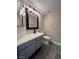 Bathroom showcasing a vanity with gray cabinets, white countertop, and dark fixtures at 3238 Canyon Terrace Dr, Laughlin, NV 89029