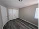 Bedroom featuring closet with sliding doors and a large window at 3238 Canyon Terrace Dr, Laughlin, NV 89029