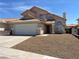 Charming two-story home with a well-maintained front yard and neutral color scheme at 3238 Canyon Terrace Dr, Laughlin, NV 89029