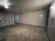 Spacious two car garage with garage door with windows and a door for entering the home at 3238 Canyon Terrace Dr, Laughlin, NV 89029