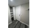 Hallway featuring built-in shelving and gray wood flooring at 3238 Canyon Terrace Dr, Laughlin, NV 89029