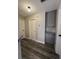 A hallway featuring gray wood flooring and gray storage cabinets at 3238 Canyon Terrace Dr, Laughlin, NV 89029
