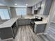 Stylish kitchen with gray cabinets, modern appliances, and bright countertops at 3238 Canyon Terrace Dr, Laughlin, NV 89029