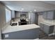 Open kitchen with bright countertops, gray cabinets, and modern stainless steel appliances at 3238 Canyon Terrace Dr, Laughlin, NV 89029