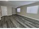 Open living room featuring modern gray wood flooring and natural light at 3238 Canyon Terrace Dr, Laughlin, NV 89029