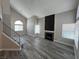 Bright living room featuring modern flooring, a fireplace, and large windows at 3238 Canyon Terrace Dr, Laughlin, NV 89029