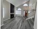 Open concept living room with high ceilings, a fireplace, and lots of natural light at 3238 Canyon Terrace Dr, Laughlin, NV 89029