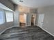Main bedroom boasts an ensuite bathroom, walk-in closet, and gray wood flooring at 3238 Canyon Terrace Dr, Laughlin, NV 89029
