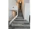 Beautiful staircase featuring modern flooring and a decorative railing at 3238 Canyon Terrace Dr, Laughlin, NV 89029