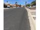 View of the quiet street with well-maintained sidewalks and easy access to the community at 3238 Canyon Terrace Dr, Laughlin, NV 89029
