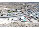 Expansive aerial view of a desert residential community showcasing neat homes and surrounding landscape at 3241 E Winery Rd, Pahrump, NV 89048